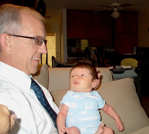 Grandpa Don bouncing the boy